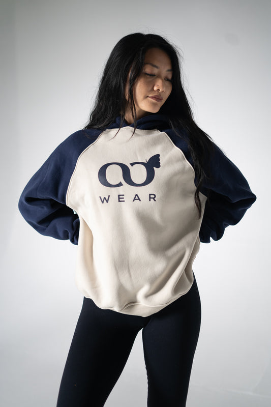 Women's comfort hoodie available in blue and cream colors. It is a pullover hoodie known for being super comfortable, soft, and made from high-quality materials. It is popular and considered one of the best hoodies for its comfort.
