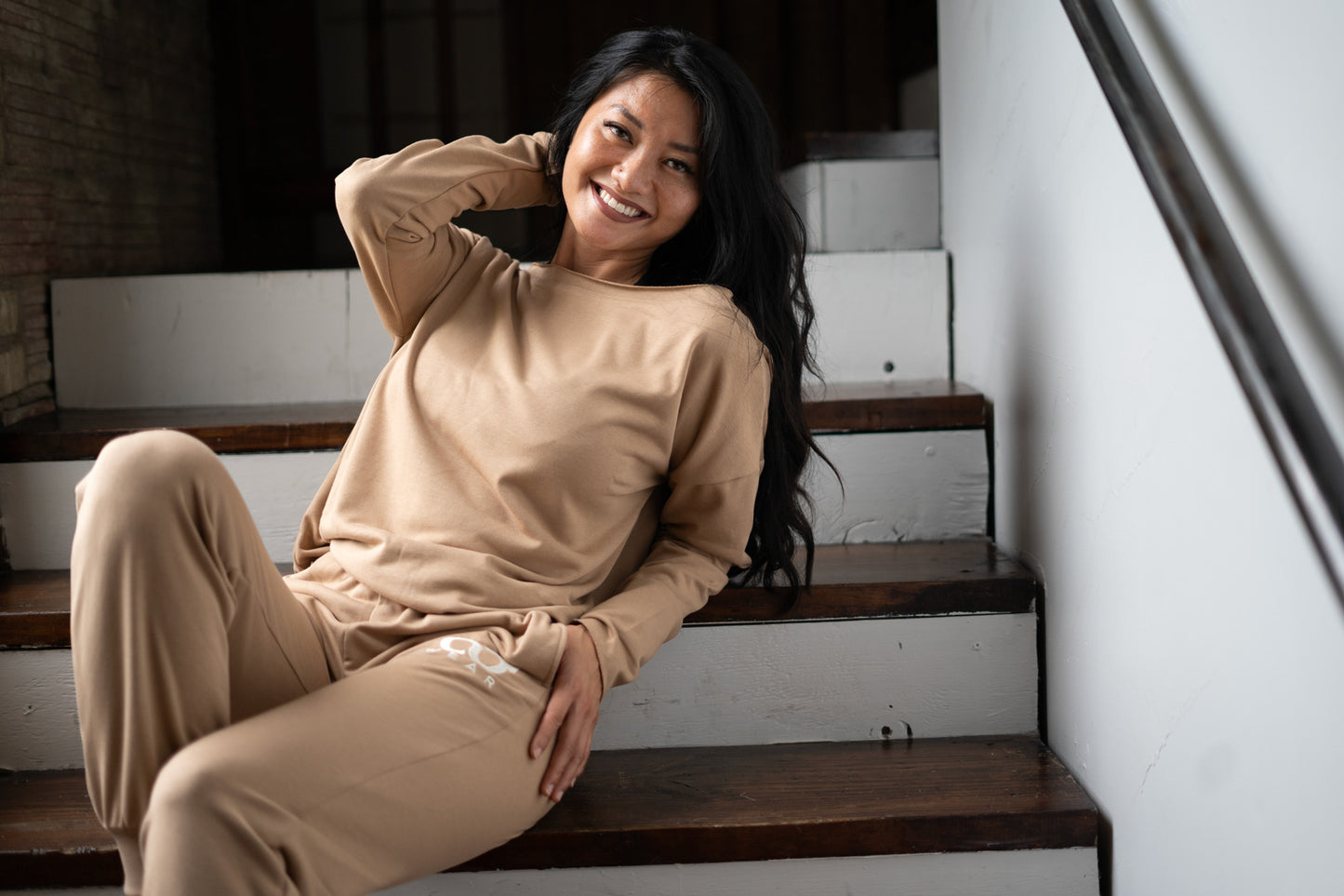 This brown color 2-piece loungewear set for women, including a sweatshirt and pants. Designed for everyday comfort or travel, it offers a relaxed and laid-back style. Made from breathable, high-quality materials, it's both popular and sustainable, making it a must-have addition to any wardrobe